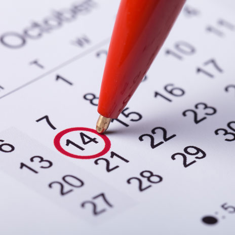 Close-up photo of a calendar with a date circled