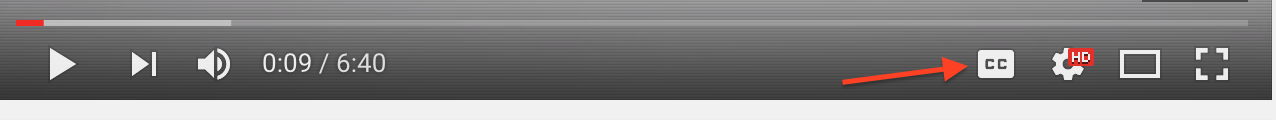 YouTube player with arrow pointing to closed captions button.
