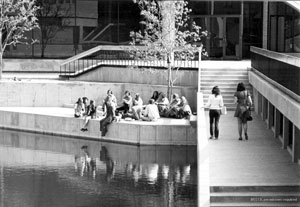 Class is conducted outdoors by the lake at Richland College