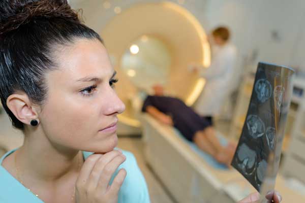 Medical worker looking at xrays