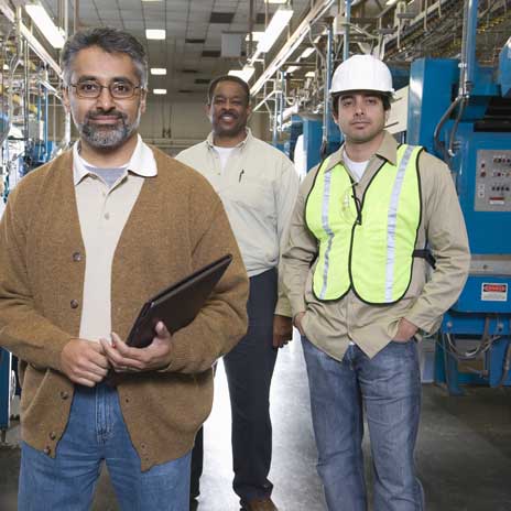 Workers stop for a break in a factory.