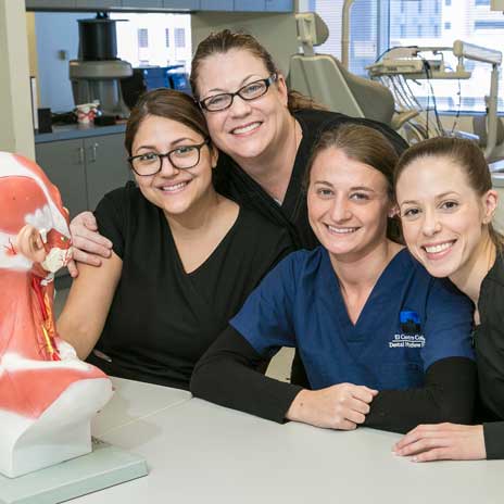 group of female dental students smiling