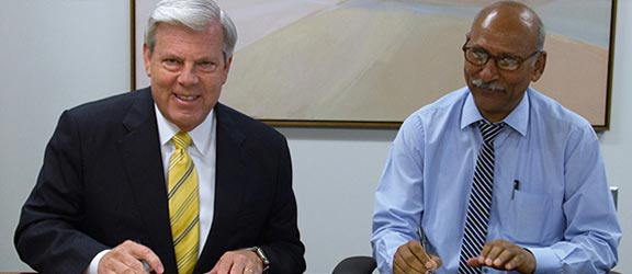 Dr. Joe May, chancellor, DCCCD, and Dr. Brijender Singh Panwar, president of PCTC, located in India, sign the Memorandum of Understanding that will serve as a framework as the two schools explore international projects and joint educational programs.