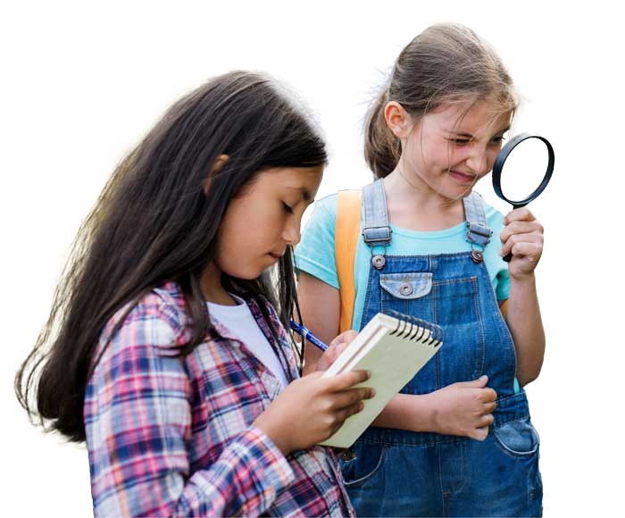 Girls looking through magnifying glass