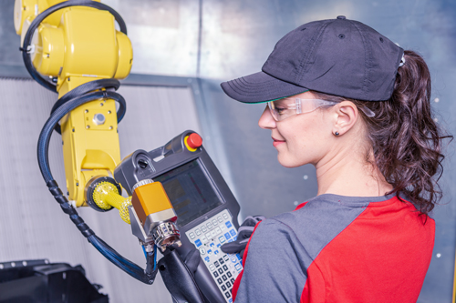 female working on robotics machine