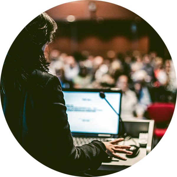 Woman giving a speach or presentation in an auditorium