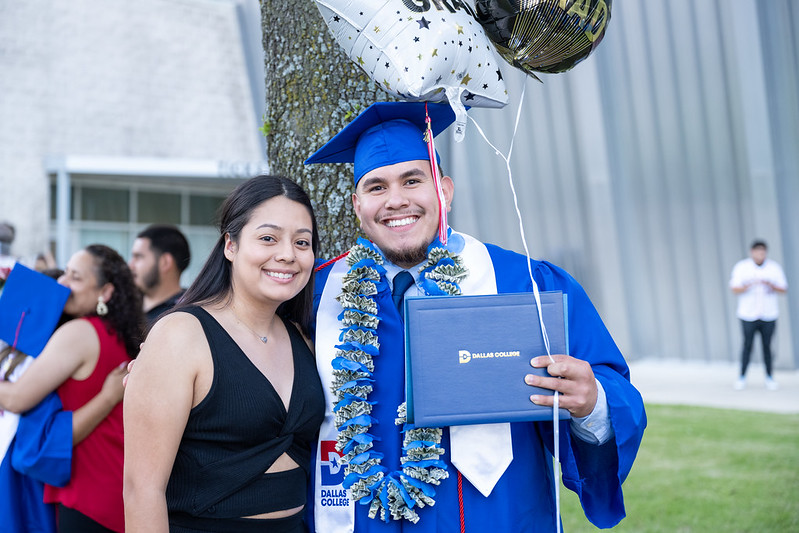 Dallas College Graduate with family
