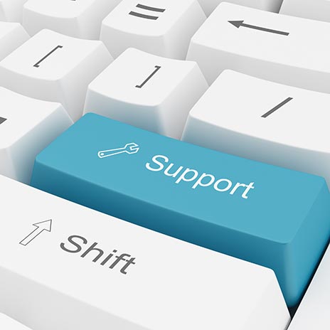 Close-up of a keyboard with a blue key labeled 