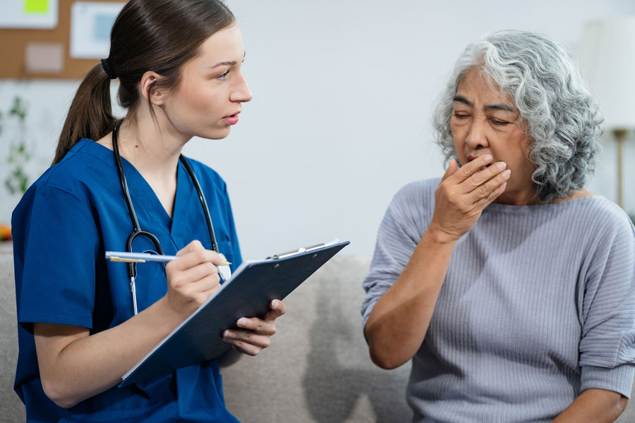 Elderly woman receives a health checkup with psychiatric aide