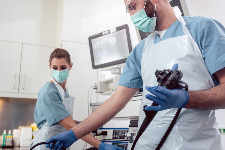 two endoscopy technicians prep for a procedure