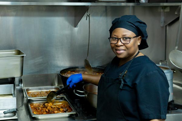 female student working in the kitchen