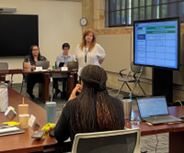 A facilitator discusses a problem with focus group participants