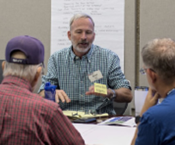 Participants discuss options while taking part in a world cafe