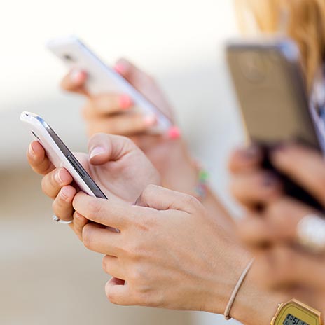 hands holding phones