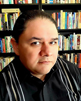 A portrait photo of Ruben Arellano