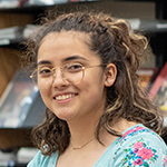 Closeup of a smiling student in the library