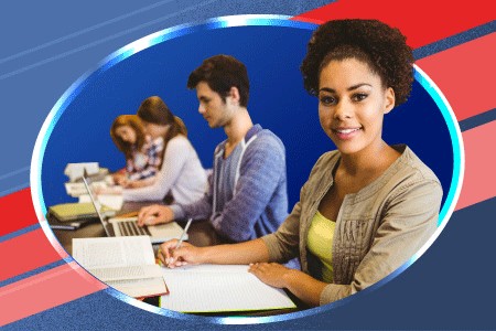 a row of students sitting in a classroom taking notes