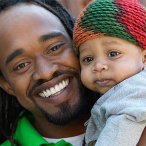 father and his baby son smiling