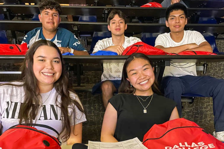 Students sit in a auditorium waiting for NSO to strat