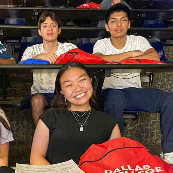 Students sit in a auditorium waiting for NSO to start