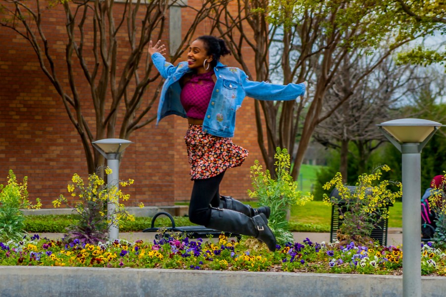 A student jumps through the air at the Richland campus