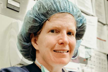 Caroline Ferris dressed in scrubs.