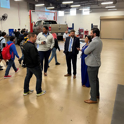 Dr. Justin Lonon standing in a auto shop lab.