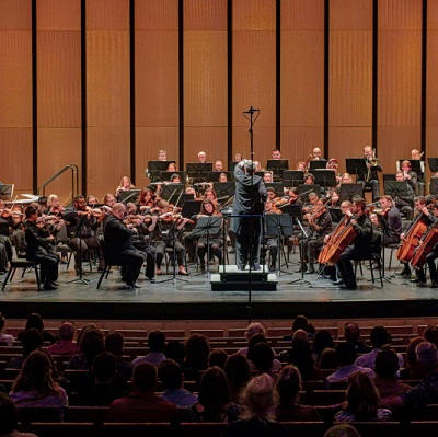 Kathryn Brownlee conducting the New Texas Symphony Orchestra.