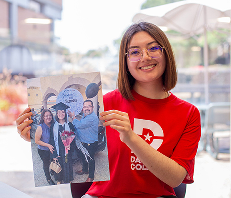 Elisa Ramos holding family photo