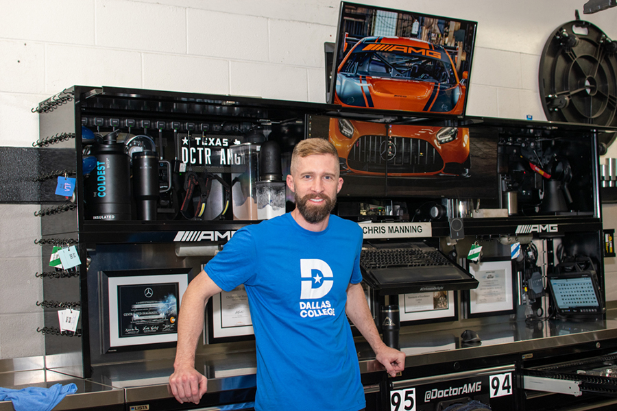 Chris Manning in front of workstation