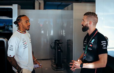 Chris Manning speaking with Lewis Hamilton.