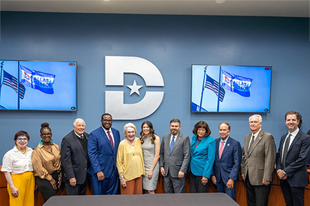 Two Myers-LeCroy scholars pose with Dallas College Board.