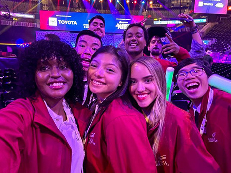 Group of seven SkillsUSA competitors pose for selfie.