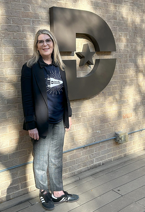 Lara Dodson-Tello standing next to wall