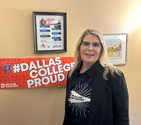 Lara Dodson-Tello next to Dallas College poster