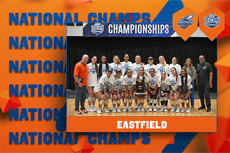 Eastfield volleyball team poses with national trophy.