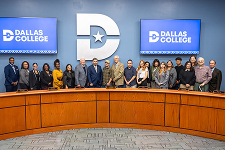 Journalism students are photographed with Dallas College Board of Trustees at the board meeting.