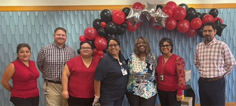 Vasana Moran-Hernandez poses with colleagues