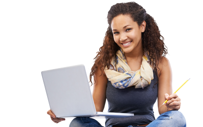 Student sitting down and smiling with a laptop and pencil
