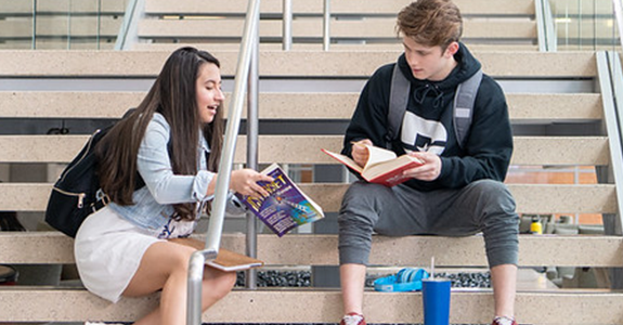 Students study on the stairwell at Richland Sabine Hall