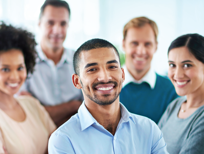 a group of students standing in a team formation smiling