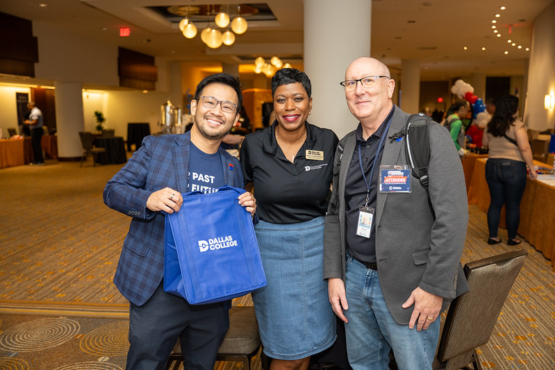 Employees show off Dallas College swag at Conference Day