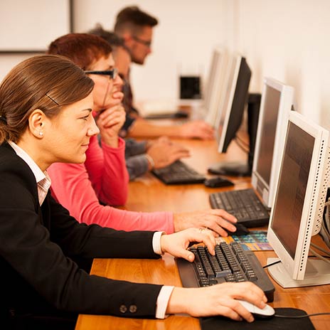 group of students taking a test on computers