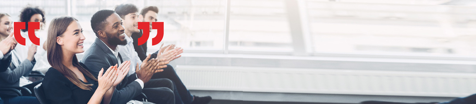 Row of employees clapping in an office an environment