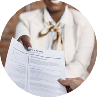 A person handing a resume