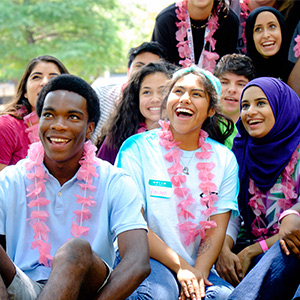 Students wearing pink leis