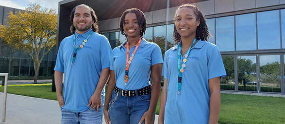 STEM students pose for a photo outside a Dallas College campus