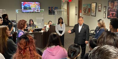 Students from the Student Insititute listen to a presenter during a tour