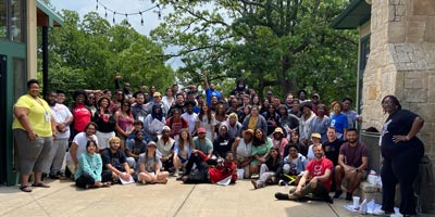 Students pose for a group photo at an event