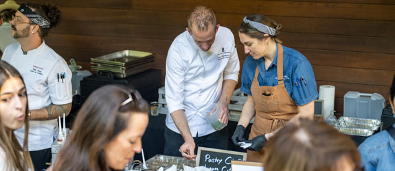 Hospitality students prepare plates at Bits and Bites